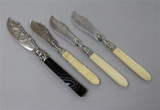 Three Victorian ivory handled silver butter knives including a pair and a similar banded agate handled butter knife.